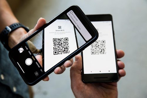 two phones scanning a qr code