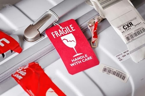 Luggage with fragile sticker